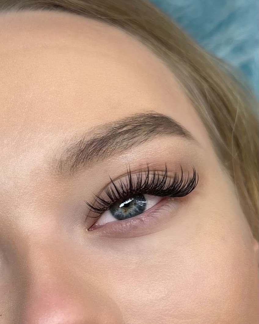 Close-up of an eye with full, fluffy lash extensions