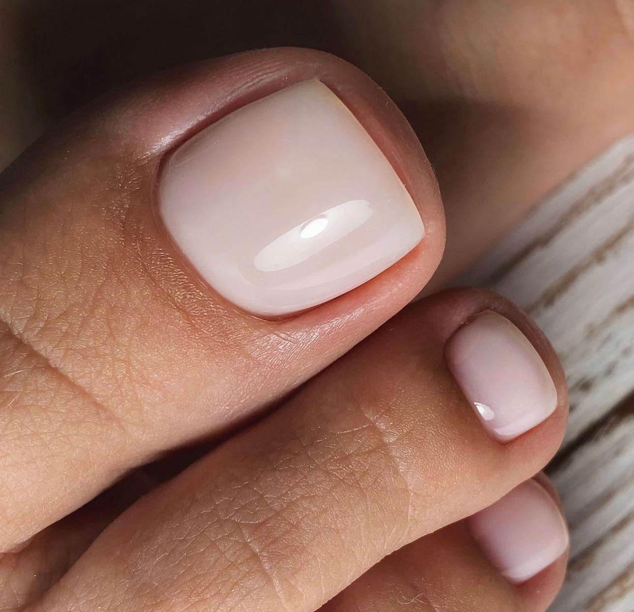 Close-up of a pale pink French manicure