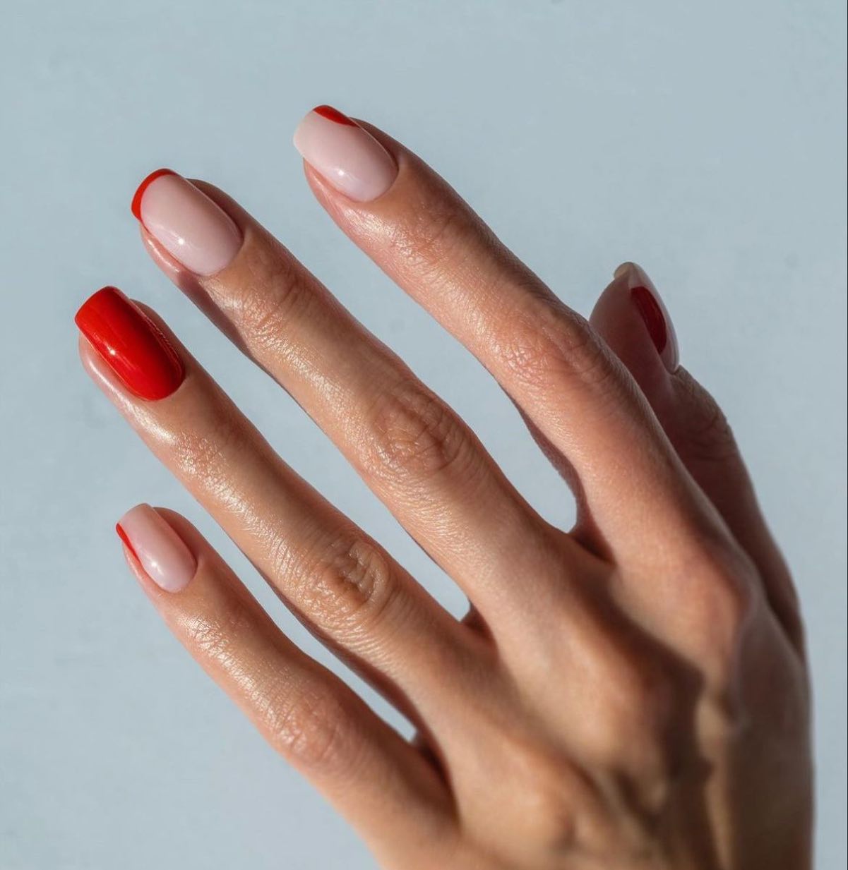 Nude nails with red French tips